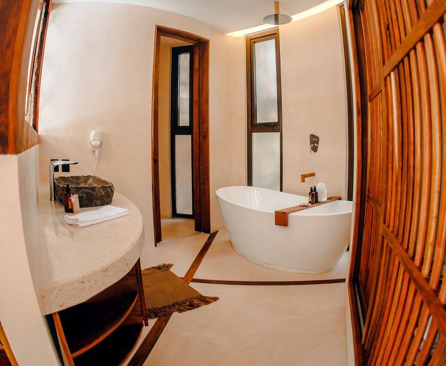 Freestanding soaking tub with rain shower